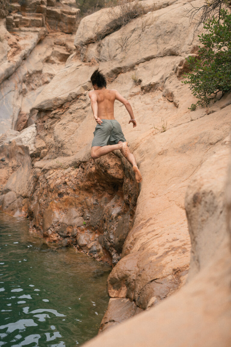 Jumping into the water pools of paradise valley