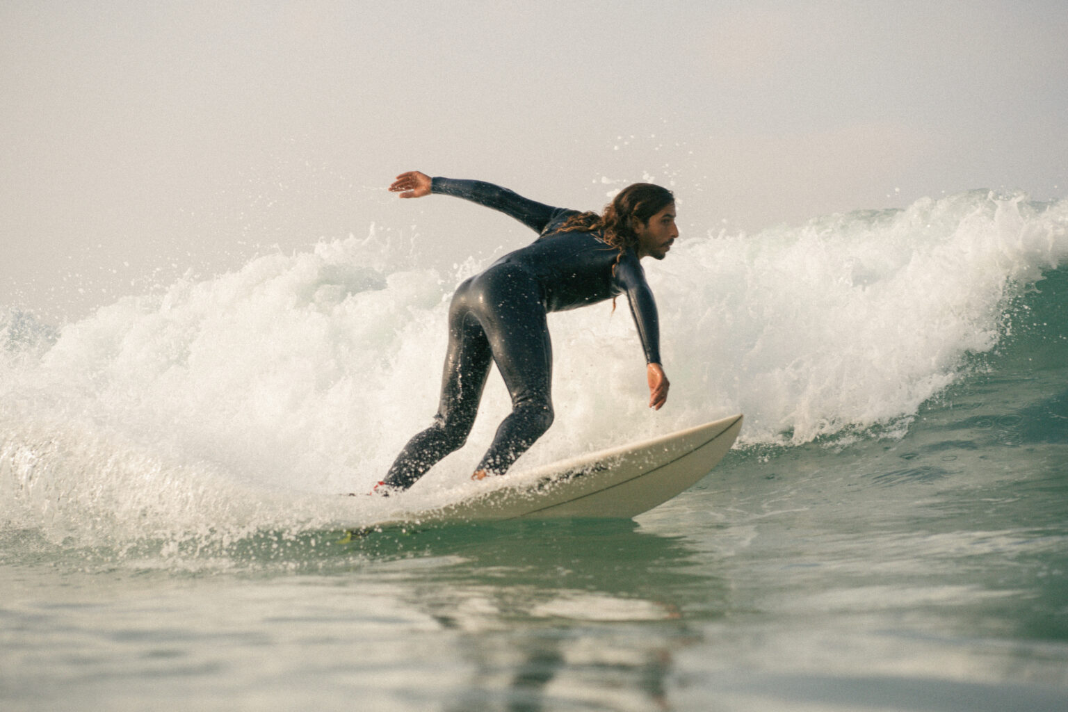 Advanced surfer doing manuver at anza beach, agadir