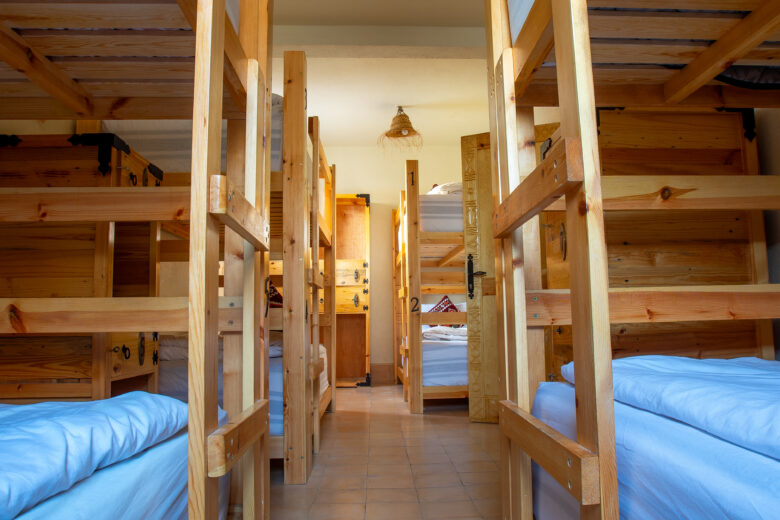 mixed dorm room with eight bunk beds