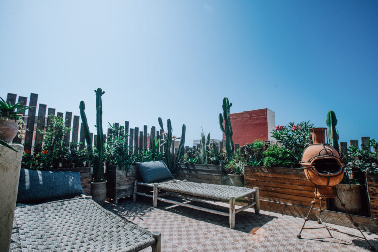 rooftop terrace with two sun loungers at anza surfhouse surf camp