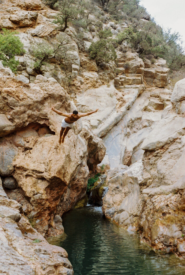 Man jumping in natural water at Paradise Valley